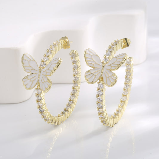 Pendientes de mariposa blanca con decoración Xin y microincrustaciones de circonitas circulares