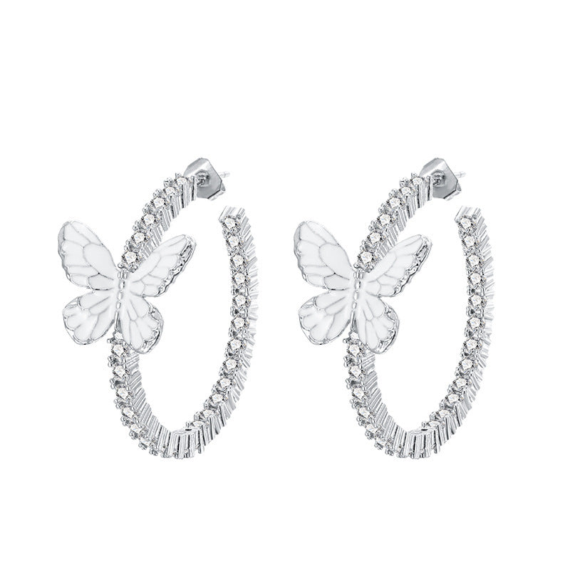 Pendientes de mariposa blanca con decoración Xin y microincrustaciones de circonitas circulares