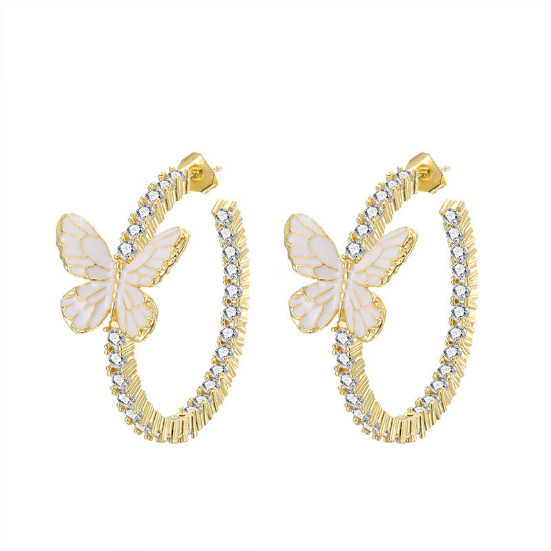 Pendientes de mariposa blanca con decoración Xin y microincrustaciones de circonitas circulares